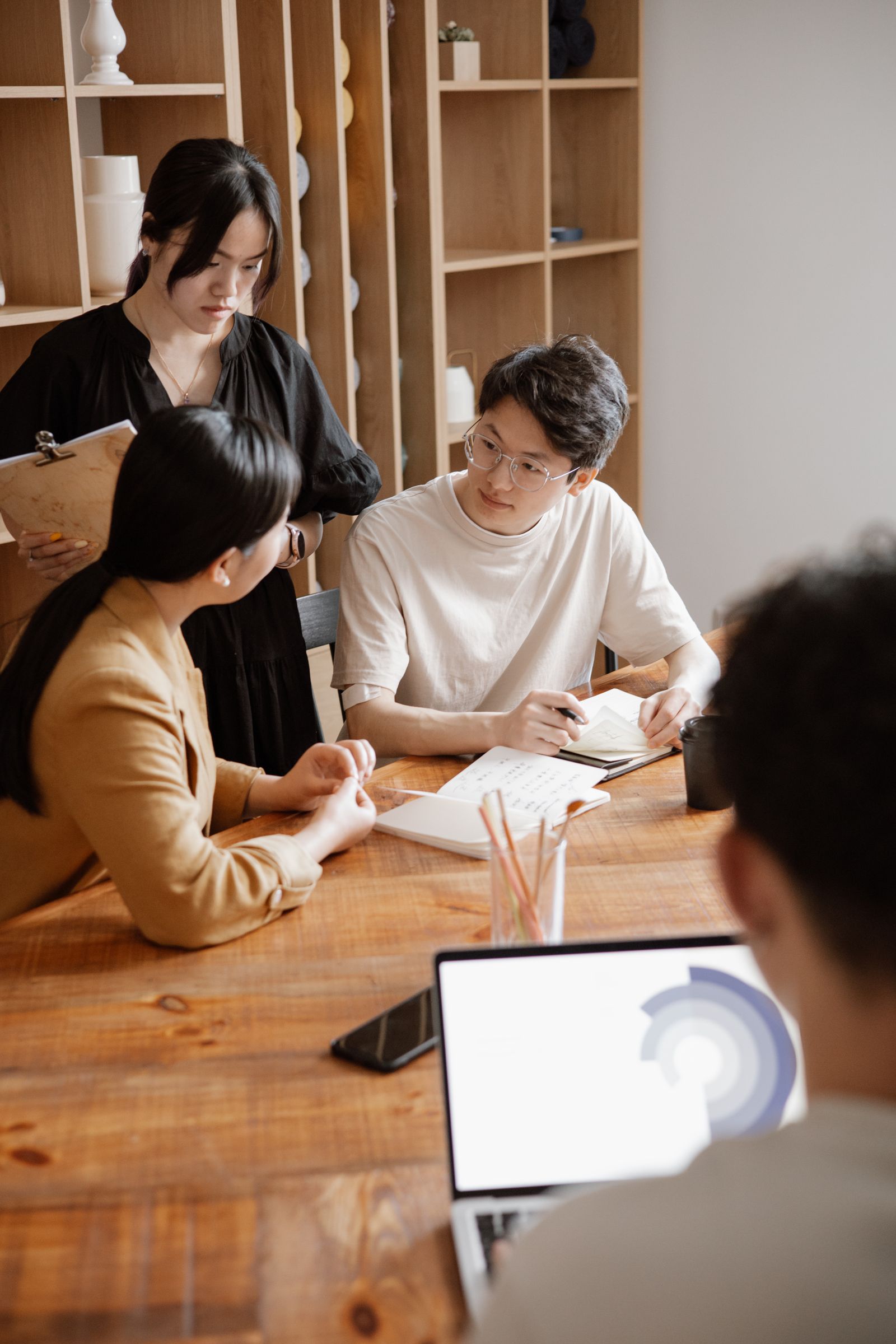 People discuss ideas and plans during a working session